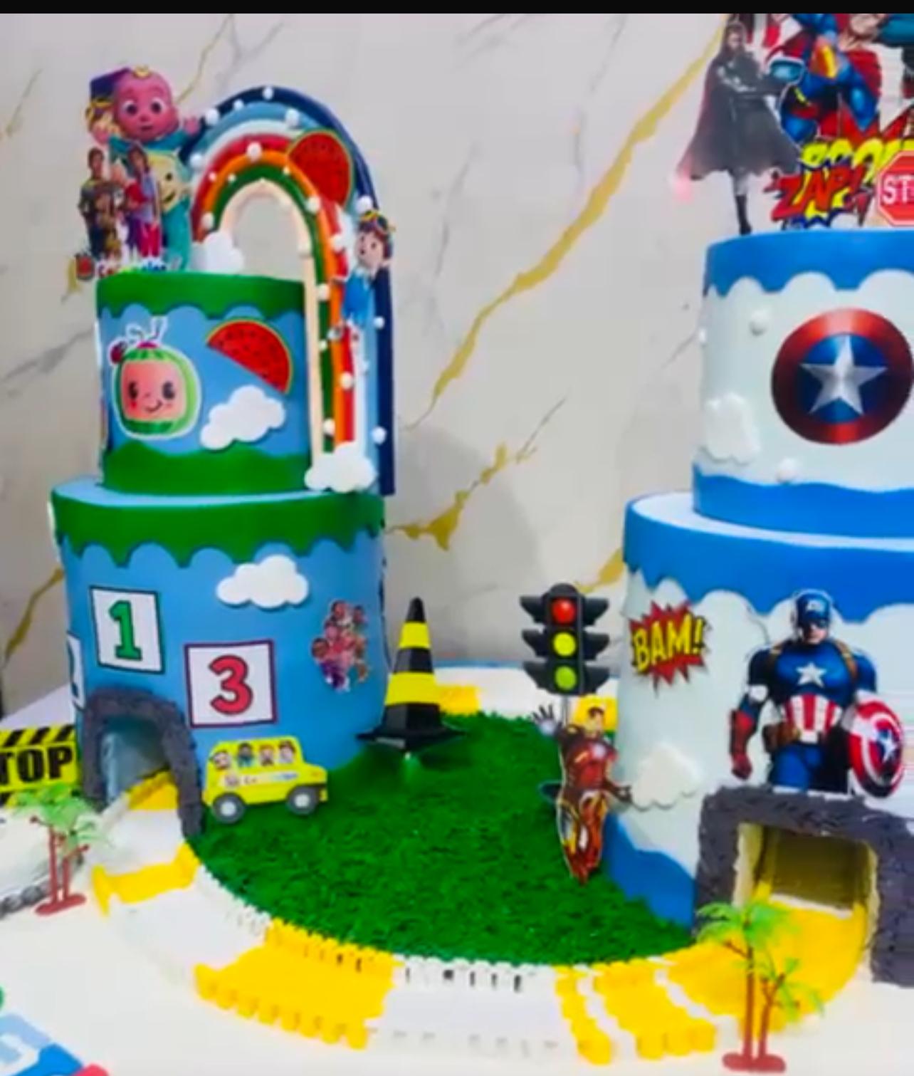 Cocomelon and Captain America children's birthday cake display